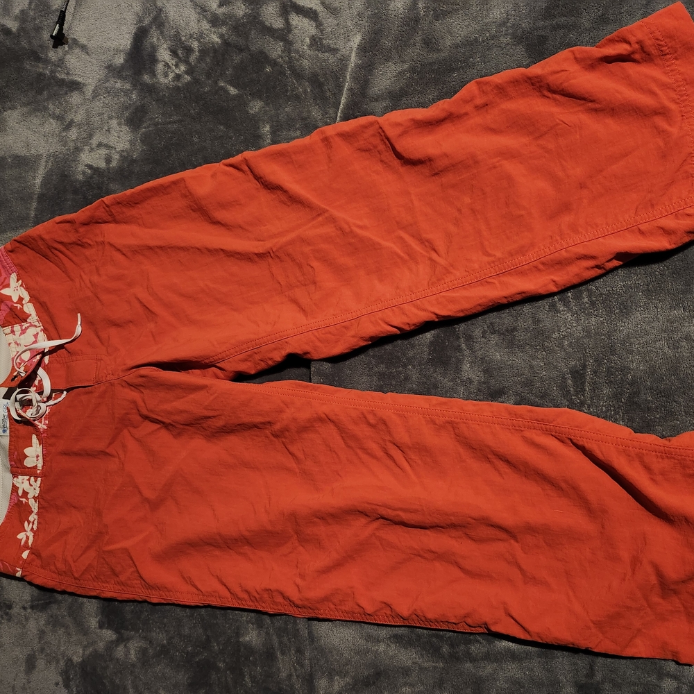 Pantagonia Loooooong Board Shorts. Orange Drawstring Pants with Floral Detail.
